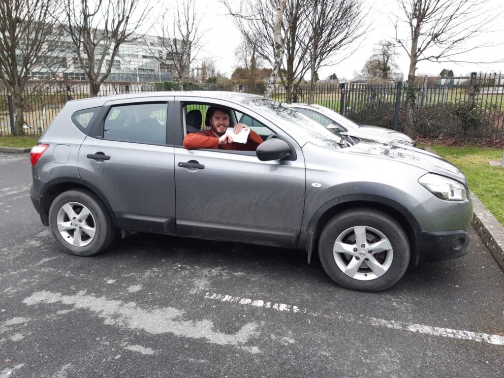 Driving instructor giving feedback in Naas